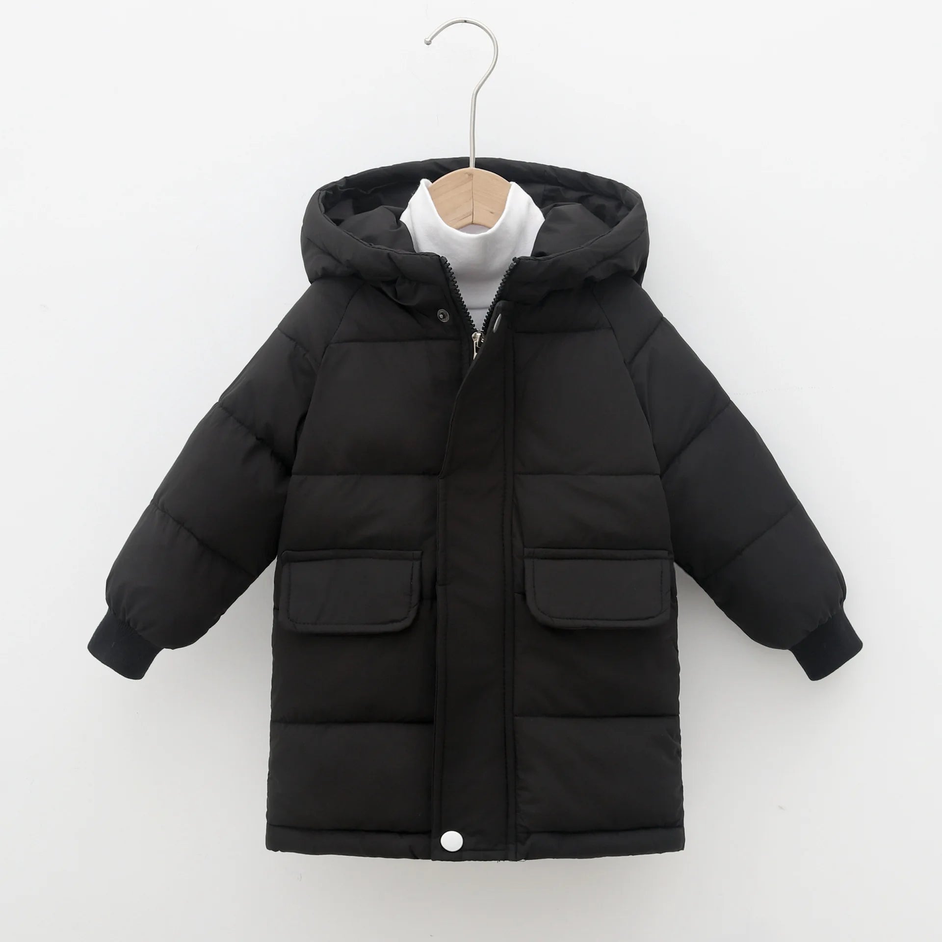 Black puffer jacket on a hanger